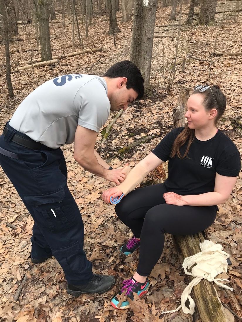 EMT Applying Arm Splint to Civilian's Arm