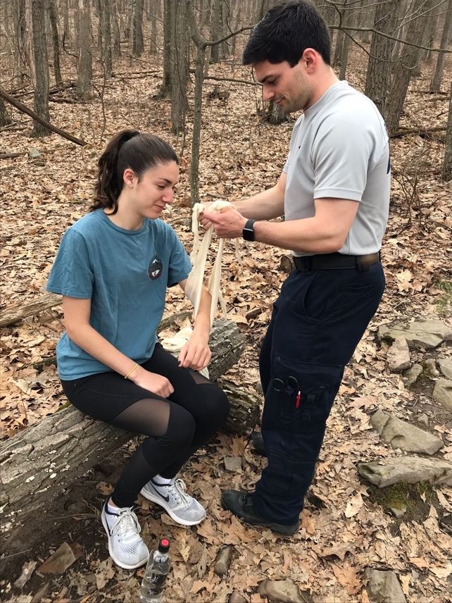 EMT Applying Sling and Swathe